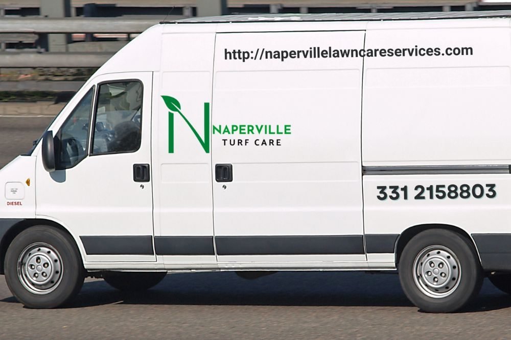 A white van featuring the name "Naperville Turf Care" written on its exterior.